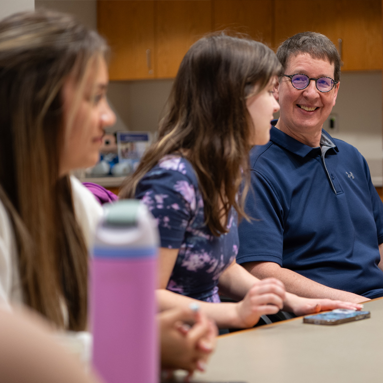 Photograph of CS students working with clients