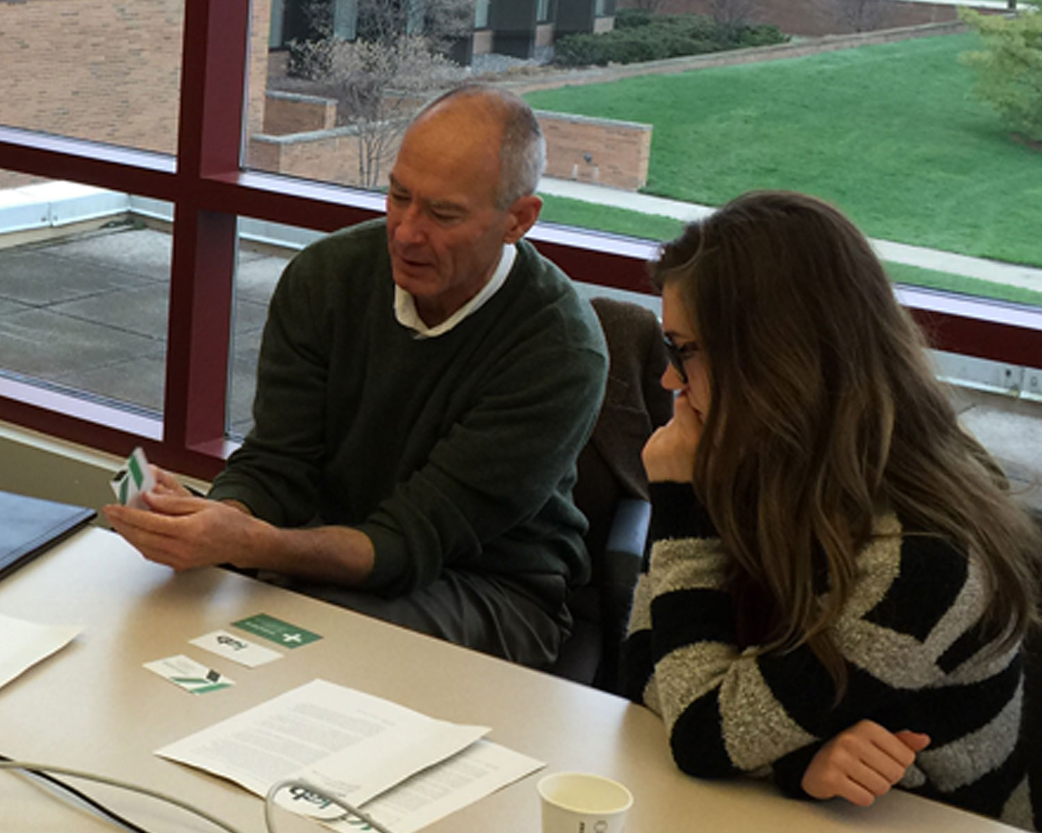photograph of student meeting with client